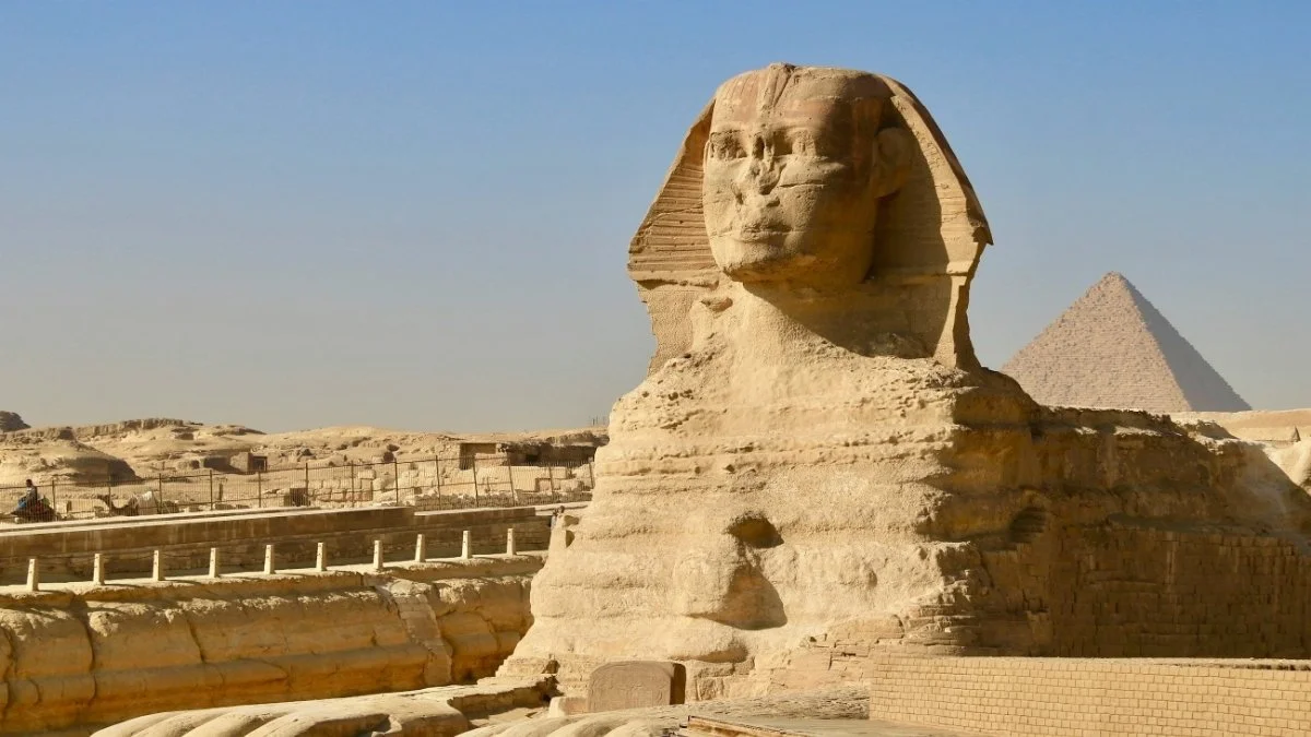 Close view of the Sphinx's face showing the missing nose and damaged surface
